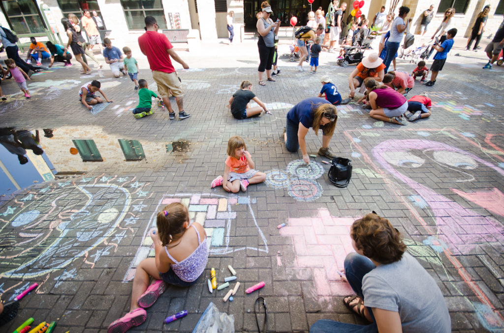 Families get creative with their own chalk art during Artpace Chalk It Up