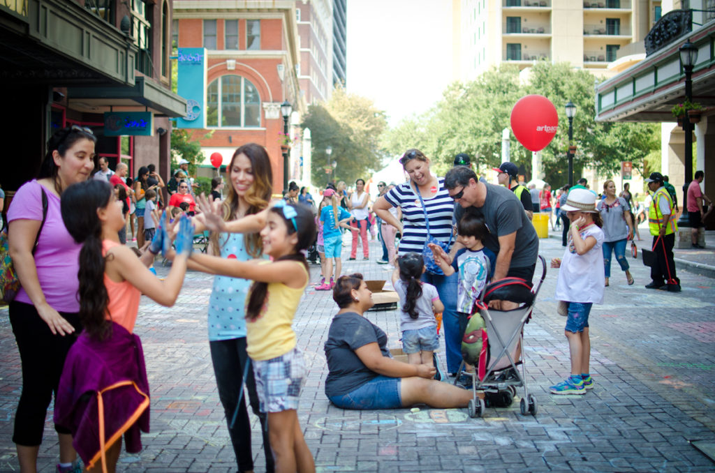 Families enjoy Artpace Chalk It Up on Houston Street
